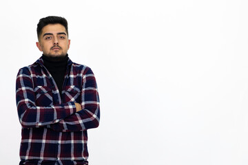 Fototapeta premium Young man wearing a dark striped shirt. He has a dirty beard White background. Isolated image. 
