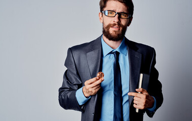 Business man in a suit with cryptocurrency in his hand Bitcoin business exchange rates wealth