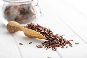 Uncooked red rice. Raw wild rice.