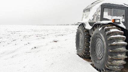 All-terrain vehicles on a winter background. Powerful off-road transporter. Engine, cross. Adventure concept. © kalyanby