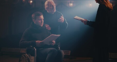 Actors rehearsing play with director