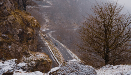 mountain road in december with snow