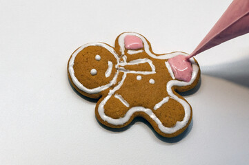 Plain gingerbread man on white background. Ideal as simple concept or with your customized decorations and text added.