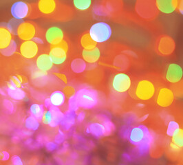 festive background of blurred colorful bright lights.