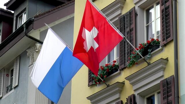 Swiss flag and Luzern City flag, Lucerne, Switzerland.
