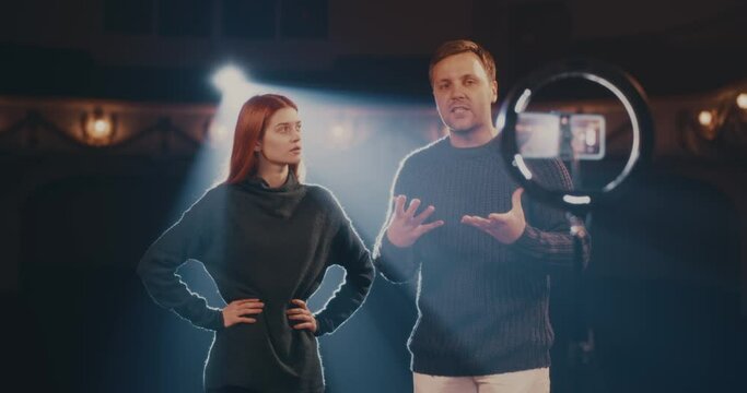 Actor and actress showing stage smile for online audience