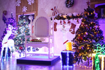 Christmas tree and chair for Santa Claus in a cozy living room