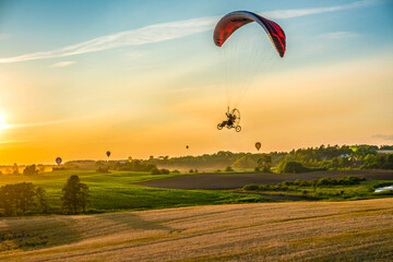 Powered paragliding over the countryside