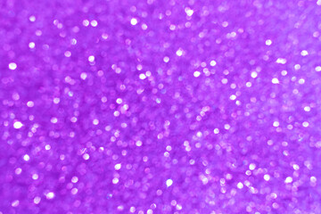 Abstract purple glitter sparkling shiny light background. Concept of New Year, Christmas and All Celebrations.