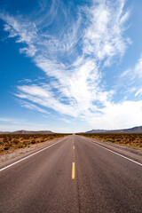 Long straight empty desert road