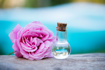 Bottles with essential aroma oil and flower