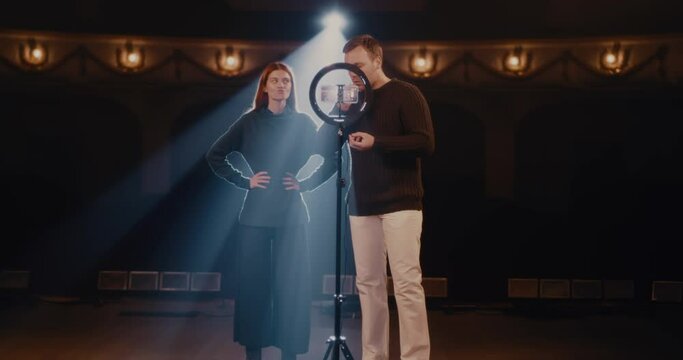 Man and woman showing articulation exercises for actors