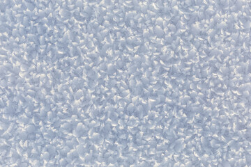 Winter, snow and frost, surface structure of a winter landscape with large crystals, space texture, white background.