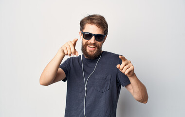 man in sunglasses wearing headphones listening to music lifestyle