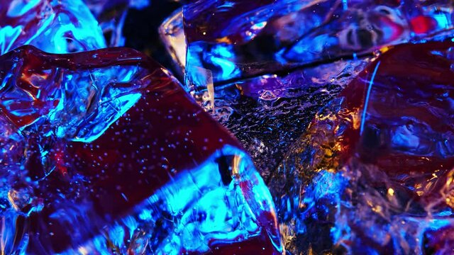 abstract colorful background with ice cube. Bright and beautiful colors of different luminous ice cubes of frozen ice