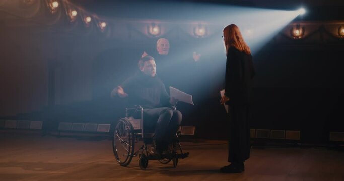 Actors with script acting out argument with director
