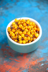 bottom view sea buckthorn on blue red table