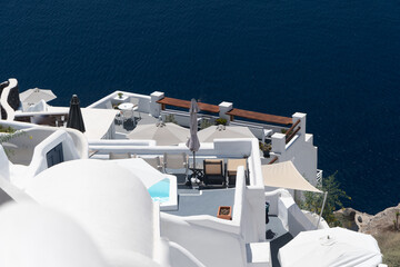 Balconies and roof tops in the village of Oia, Santorini. Architecture and landscape of Greece.