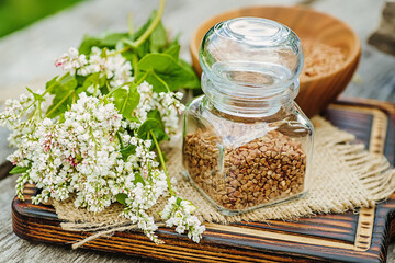 Transparent jar for loose products with dry buckwheat.