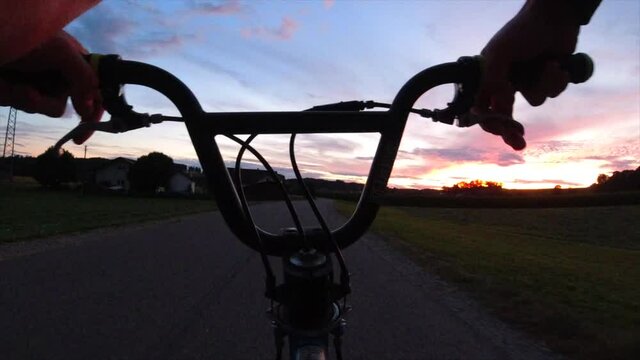 FPV riding a BMX at sunset