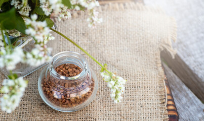 Transparent jar for loose products with dry buckwheat.