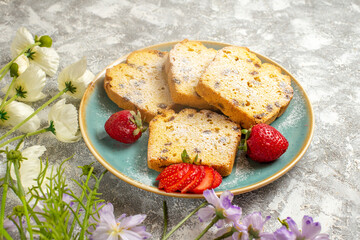 front view yummy cake slices with strawberries on light background cake fruits sweet pie