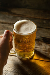 Mug of beer on dark background