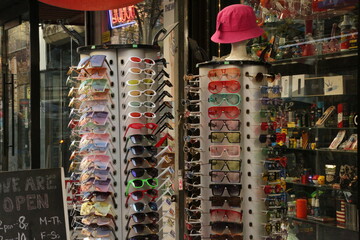sunglasses display in front of a smoke shop