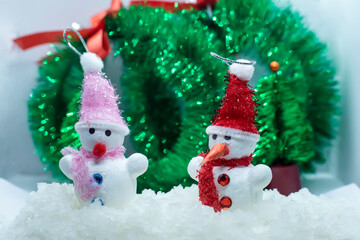 Merry Christmas and happy new year greeting card .Two cheerful snowman standing in winter Christmas landscape