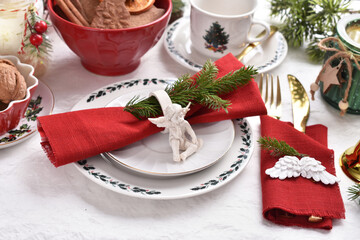 Christmas table setting in white red green colors