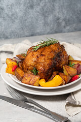 Нoliday food roast chicken or poultry with potatoes and vegetables on a white plate. dish for family dinner or lunch Christmas New Year Thanksgiving