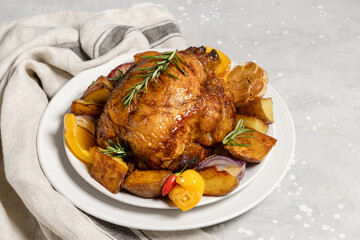 Нoliday food roast chicken or poultry with potatoes and vegetables on a white plate. dish for family dinner or lunch Christmas New Year Thanksgiving