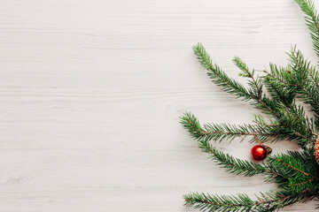 Christmas Composition on a White Wooden Table with Copy Space