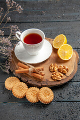 front view cup of tea with lemon and cookies on dark background photo ceremony drink