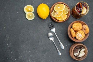 top view fresh lemon slices with cookies on dark background juice sour citrus fruit