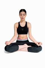 Fototapeta premium Young woman doing yoga practice isolated on white background. Flexible fit female body.