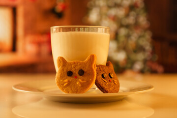 Cocoa and gingerbread cookies for New Year's Eve and Christmas themed. An image of a cat-like...
