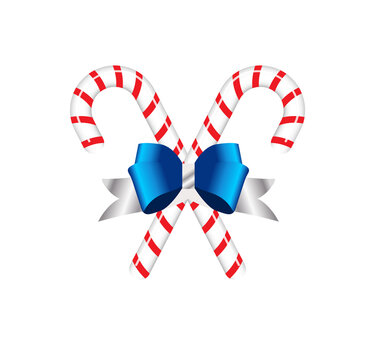 Striped christmas candy cane with blue bow on white background
