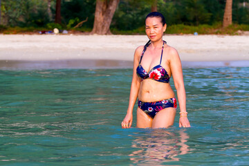 Obraz premium Woman in water with bikini beautiful