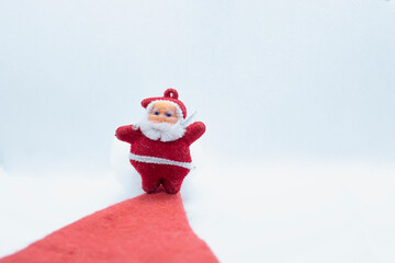 Santa Claus standing on the red carpet on a white background