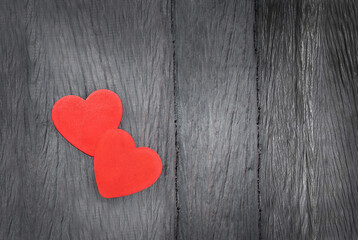 two hearts on a wooden background