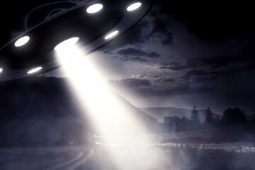 UFO over a field with light beams.