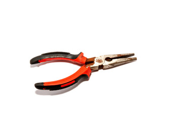 Old rusted pliers, rubber grip, 2 colors, black-red, old equipment placed on a white background, viewed from above