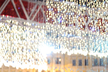 Christmas street lighting bright yellow defocused bokeh lights celebration background
