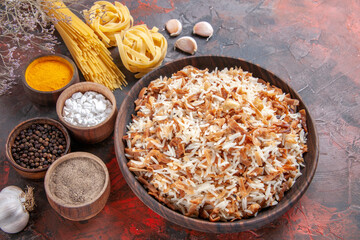 top view cooked rice along with seasonings on dark background food dish meal
