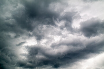 Fototapeta na wymiar a dramatic black cloud background that looks like rain.