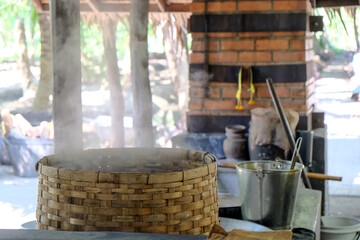 The process of making palm sugar by the traditional Thai method.