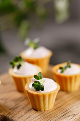 Canapes with light cream filling. Still life with microgreens. The concept of an appetizing snack.