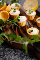 Canapes with light cream filling. Still life with microgreens. The concept of an appetizing snack.