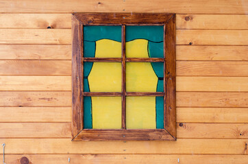 Close-up  of colorful window of the cottage